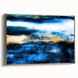 Framed wall art showcasing an abstract design of gold strokes and lines on canvas, set against a textured background for modern decor.