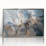Framed abstract wall art featuring dynamic strokes and lines in silver tones, adding a modern touch to any interior decor.