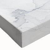 Close-up of an abstract canvas wall art design showcasing vibrant strokes and lines in shades of blue, pink, and gold, perfect for modern decor.