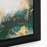 Close-up of a framed abstract wall art piece with vibrant strokes and lines in shades of blue, orange, and yellow, showcasing modern design elements.