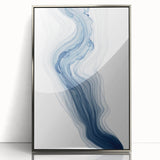 Framed wall art featuring an abstract design of colorful strokes and lines in silver, perfect for modern home décor and artistic expression.
