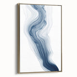 Framed wall art showcasing an abstract design with gold strokes and lines, adding elegance to modern decor in a stylish setting.