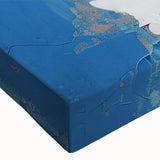 Close-up of an abstract canvas wall art piece showcasing vibrant strokes and lines in shades of blue, yellow, and orange, perfect for modern decor.