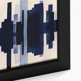 Close-up of a framed canvas featuring an abstract strokes and lines design, showcasing vibrant colors of blue, orange, and yellow, ideal for modern wall decor.