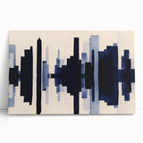 Abstract wall art featuring vibrant strokes and lines in shades of blue, orange, and yellow, printed on stretched canvas and leaning against a neutral wall. Ideal for modern home decor.