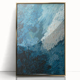 Framed wall art featuring an abstract design of flowing strokes and lines in gold and white, set against a sleek black background, perfect for modern decor.