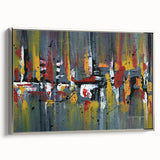 Framed canvas wall art featuring an abstract design of colorful strokes and lines, set against a sleek silver frame, ideal for modern home decor.
