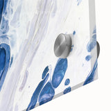 Close-up of an abstract wall art piece featuring vibrant strokes and lines in a mix of blue, orange, and yellow, designed for contemporary decor.