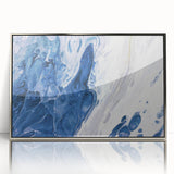 Framed wall art showcasing an abstract design featuring vibrant strokes and lines in silver tones, perfect for modern home decor. The artwork adds a contemporary touch to any living space.