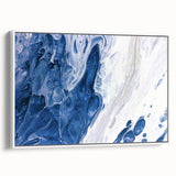 Framed canvas wall art displaying an abstract design of colorful strokes and lines, set against a white background, showcasing modern home decor style.