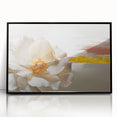 Framed wall art featuring an abstract design of colorful strokes and lines in vibrant hues, set in a sleek black frame, perfect for modern home decor.