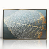 Framed acrylic wall art featuring an abstract design of gold strokes and lines on a neutral background, perfect for modern home decor.