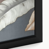 Close-up of a framed canvas wall art piece showcasing an abstract design with vibrant strokes and lines in shades of blue, orange, and gold, ideal for modern decor.