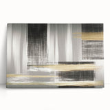 Abstract canvas wall art featuring dynamic strokes and lines in a blend of blue and gold hues, elegantly leaning against a neutral backdrop, perfect for modern home decor.