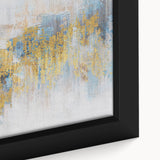 Close-up of a framed canvas featuring an abstract design with vibrant strokes and lines in shades of blue, orange, and yellow, perfect for modern home decor.