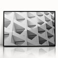 Framed acrylic print of large abstract wall art featuring geometric shapes in muted earth tones.