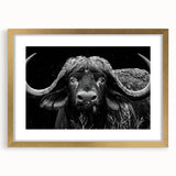 Wall art design featuring a majestic buffalo against a natural landscape, framed in gold with a mat, perfect for wildlife enthusiasts and home decor lovers. The intricate details highlight the buffalo's strength and beauty, making it an ideal piece for enhancing living spaces.