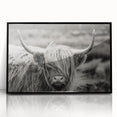 Framed wall art featuring a striking black and white cow design, showcasing intricate details against a minimalistic background, perfect for animal lovers and modern decor.