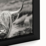 Close-up of a framed canvas wall art featuring a vibrant cow design, showcasing intricate details and textures, perfect for adding a rustic touch to home decor.