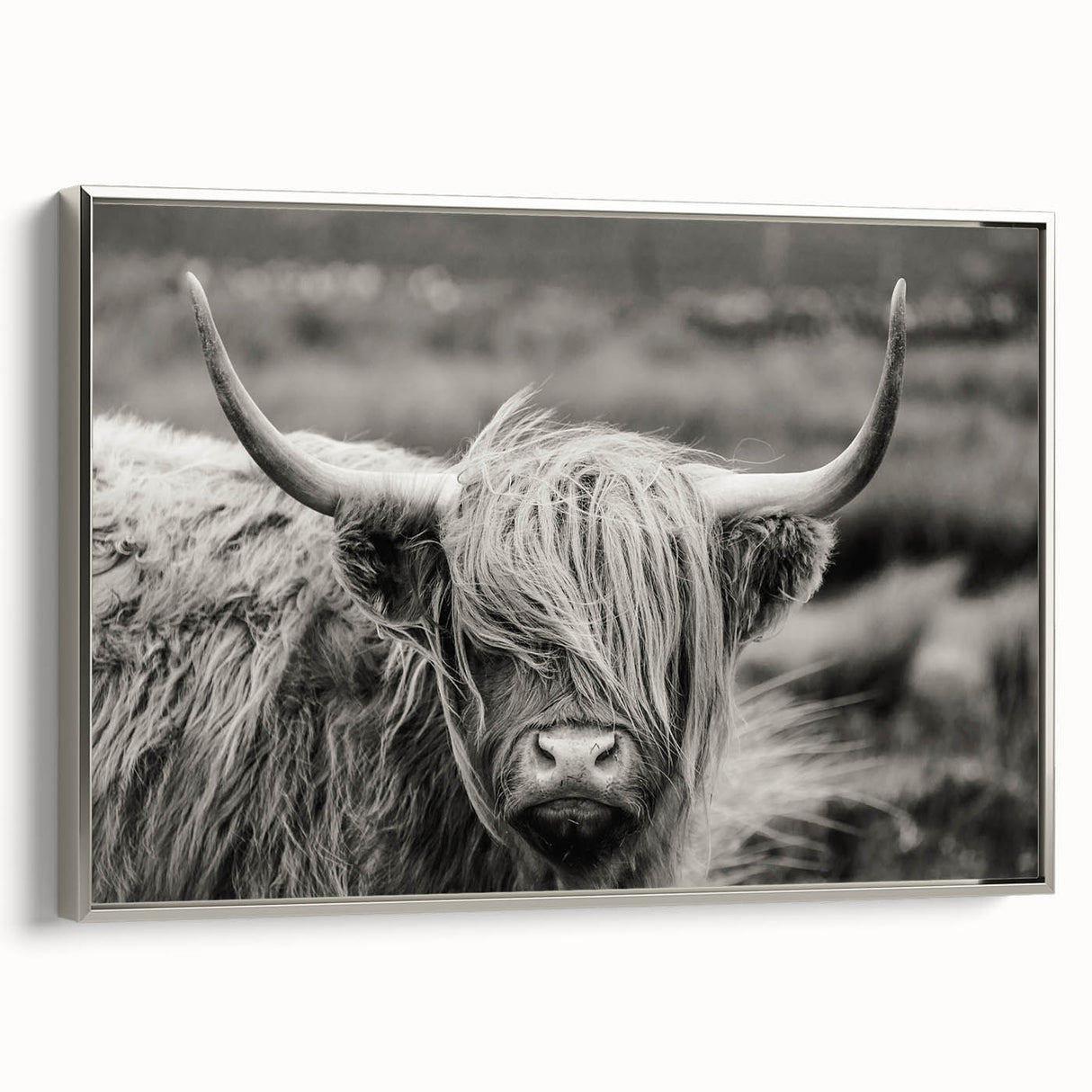 Framed canvas wall art showcasing a silver-toned cow design, ideal for animal lovers, adding a modern touch to home decor with its sleek side view.