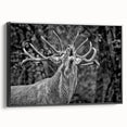 Framed wall art featuring a majestic deer design, showcasing intricate details in a black frame, perfect for nature-inspired home décor.