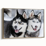 Framed canvas wall art featuring a vibrant design of playful dogs in a wild setting, with a sleek gold frame enhancing its modern appeal, perfect for pet lovers.