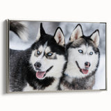 Framed canvas wall art featuring a vibrant dogs design from the "Animals A Wild Life" collection, showcased in a sleek silver frame, highlighting the playful essence of canine companions.