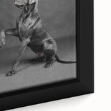 Close-up of a framed canvas wall art featuring a vibrant design of various dog breeds in a natural setting, perfect for animal lovers and home decor enthusiasts.