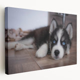 Stretched canvas wall art featuring a colorful design of various dog breeds in a playful arrangement, perfect for pet lovers and home decor enthusiasts.