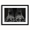 Elegant black-framed wall art featuring a majestic elephant design, set against a minimalist backdrop, perfect for enhancing modern home decor with a touch of wildlife artistry.