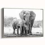Framed canvas wall art showcasing a silver-toned, side view of a majestic elephant, perfect for adding a touch of wildlife elegance to any room decor.