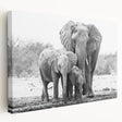 Stretched canvas wall art depicting a majestic elephant in a serene natural setting, showcasing intricate details and vibrant colors, perfect for wildlife enthusiasts.