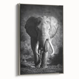 Framed canvas wall art showcasing a side view of a majestic elephant, featuring intricate details and a silver border, perfect for wildlife enthusiasts' decor.