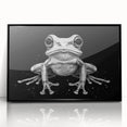 Framed wall art featuring a vibrant frog design with a black acrylic frame, showcasing a colorful wildlife theme perfect for nature enthusiasts and home decor.