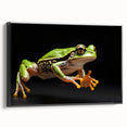 Framed wall art showcasing a vibrant green frog design on a black background, ideal for nature lovers. Perfect for adding a splash of color to home decor.