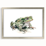 Framed wall art featuring a vibrant frog design in a silver frame, complemented by a white mat, perfect for adding a touch of nature-inspired decor to any room. Ideal for animal enthusiasts and nature lovers.