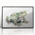 Framed wall art featuring a vibrant frog design in acrylic, set against a sleek black frame, ideal for adding a touch of nature-inspired decor to any space.