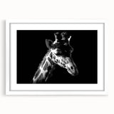 Giraffe-themed wall art print in a white frame, showcasing a vibrant design of a giraffe surrounded by greenery, ideal for animal lovers and modern home decor.