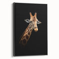 Framed wall art featuring a black and white side view of a giraffe, showcasing intricate details in its fur and posture, ideal for animal lovers and modern decor.