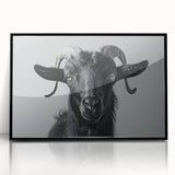 Framed wall art featuring a striking black goat design from the "Animals: A Wild Life" collection, set in a sleek black frame, perfect for modern decor.