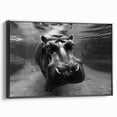 Framed wall art featuring a striking black side view of a hippopotamus, showcasing intricate details and textures, perfect for animal lovers and decor enthusiasts.