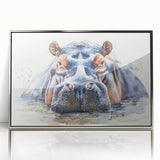 Framed wall art featuring a silver-accented, front view of a hippopotamus in a vibrant natural setting, perfect for animal lovers and home decor enthusiasts.
