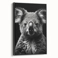 Framed canvas wall art showcasing a serene koala design against a black background, adding a touch of wildlife charm to modern decor. Perfect for animal lovers.