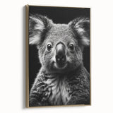 Framed wall art featuring a serene koala design in a lush green setting, with a gold frame that enhances the artwork's elegance and charm. Perfect for animal lovers.