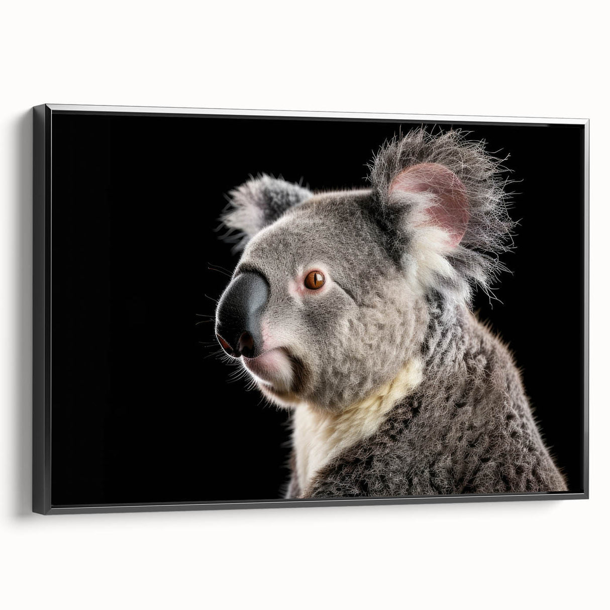 Framed wall art featuring a serene koala design on canvas, showcasing vibrant colors and a sleek black frame, ideal for nature enthusiasts and home decor.