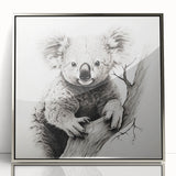 Framed wall art featuring a vibrant koala design in an acrylic finish, showcasing a silver frame. Perfect for nature lovers and home decor enthusiasts.