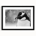 Framed wall art showcasing a penguin design from the "Animals of the Wild" collection, featuring a sleek black frame and white matting, perfect for nature enthusiasts.
