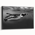 Framed canvas wall art showcasing a side view of a whimsical penguin design, featuring vibrant colors on a black background, perfect for animal lovers and home decor enthusiasts.