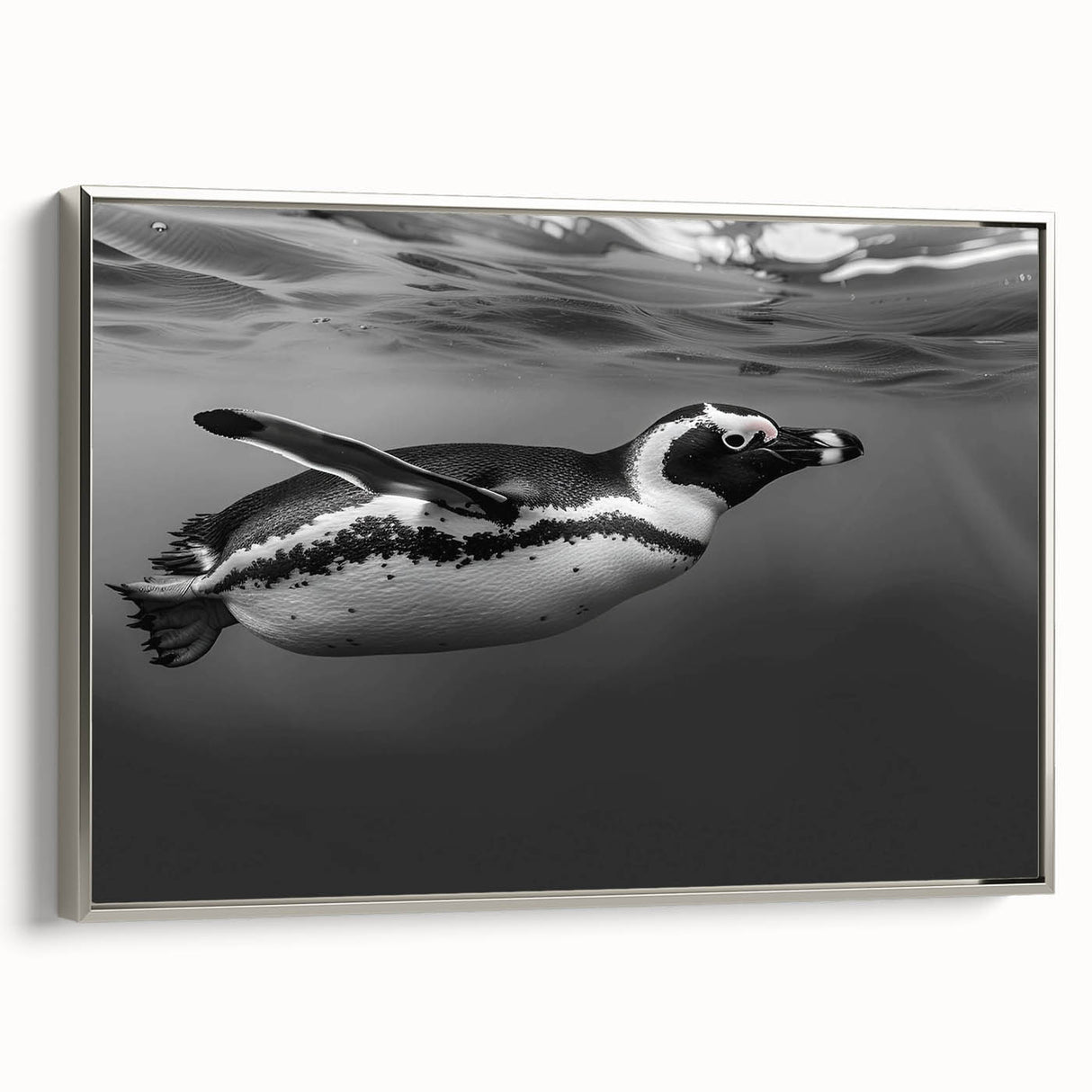 Framed wall art showcasing a silver-colored side view of a penguin design, perfect for animal lovers and home décor enthusiasts. Ideal for adding a touch of wildlife elegance to any room.