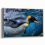 Framed canvas wall art depicting a stylized penguin design, featuring a silver frame and vibrant colors, perfect for adding a touch of wildlife charm to any room.